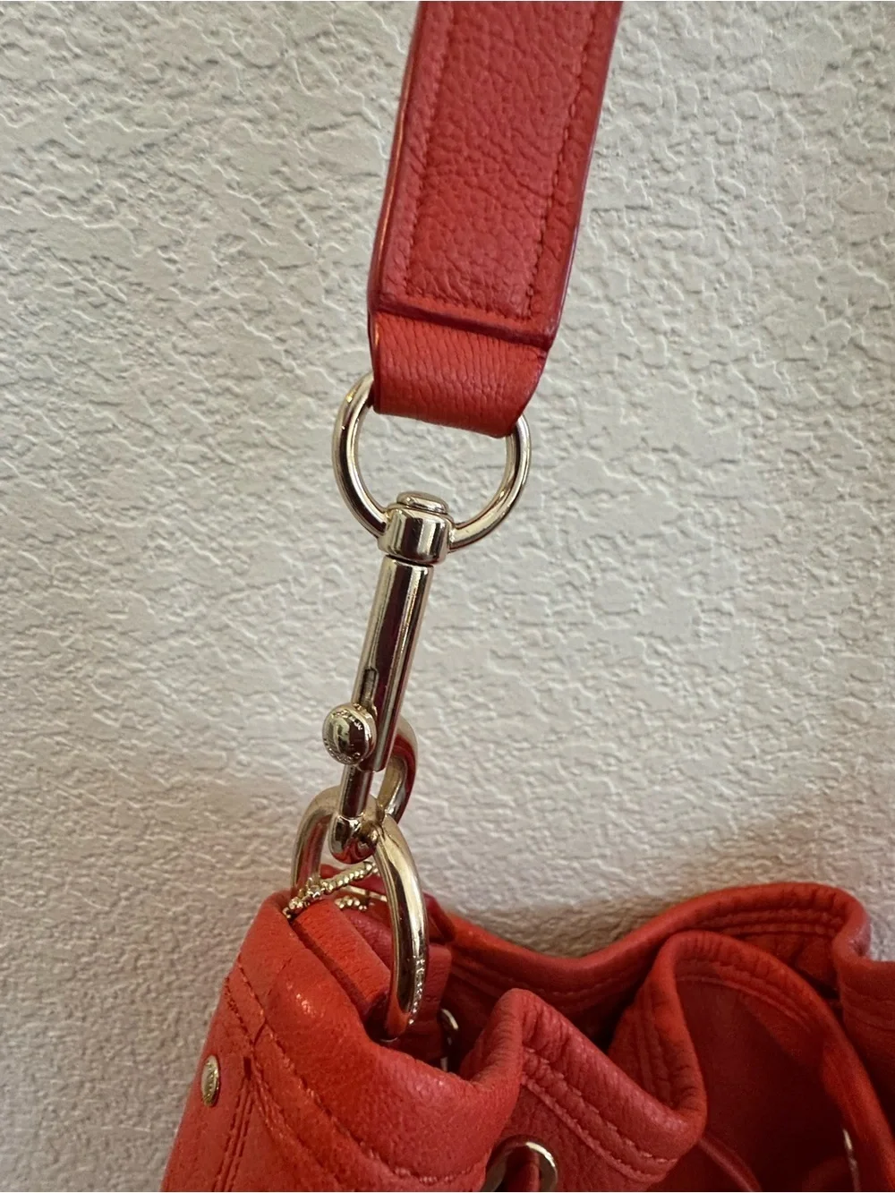 Coach Twist Lock Coral-Orange Pebbled Leather Drawstring Shoulder Bag